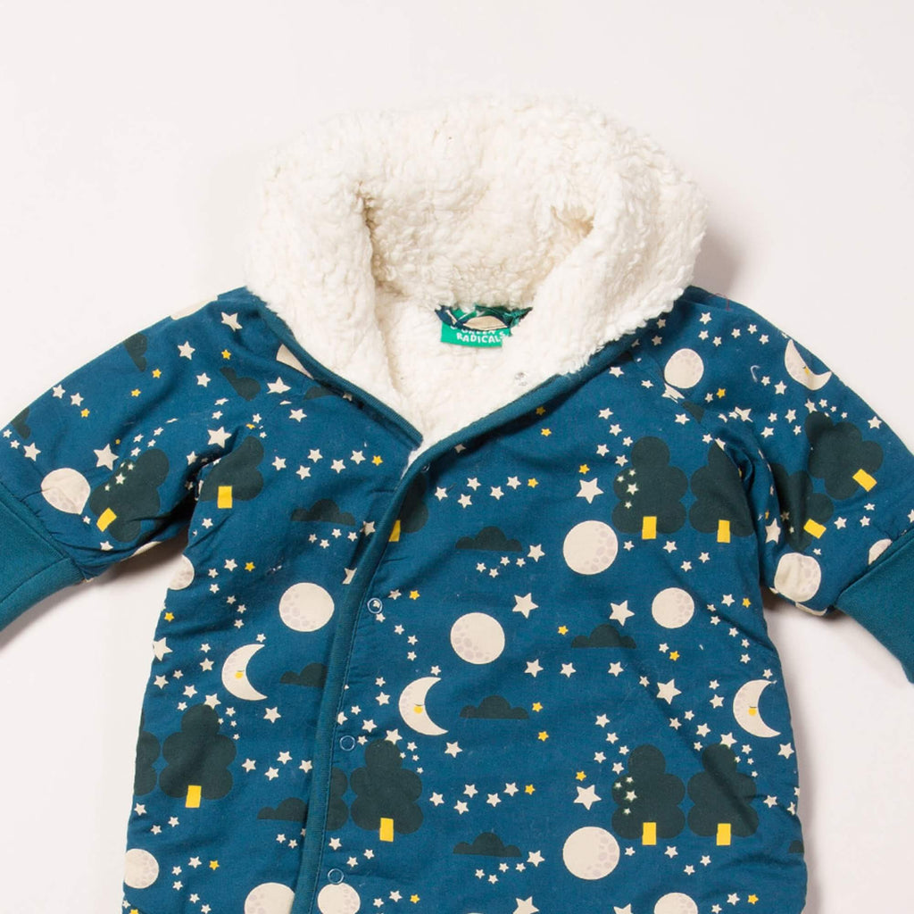 Close up of dark blue baby snowsuiit with sherpa lining, moon and star print