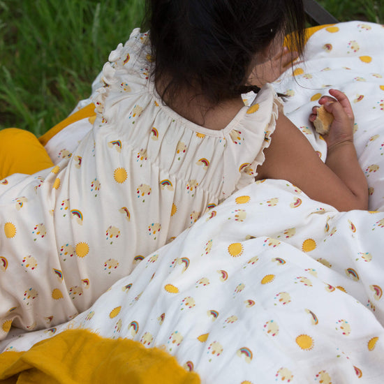 Little-Green-Radicals-Cream-Organic-Cot-Bed-Duvet-Set-With-Sunshine-And-Rainbow-Kid