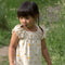 Little-Green-Radicals-Cream-Pocket-Playdays-Dress-With-Sunshine-And-Rainbow-Print-Kid-Closeup