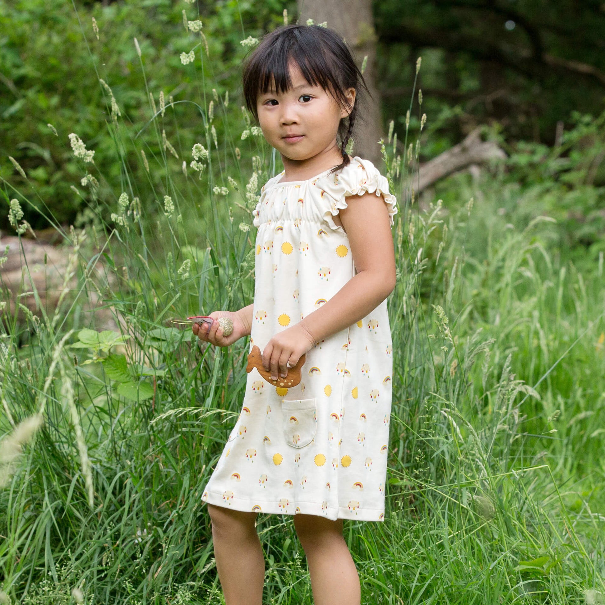 Little-Green-Radicals-Cream-Pocket-Playdays-Dress-With-Sunshine-And-Rainbow-Print-Kid