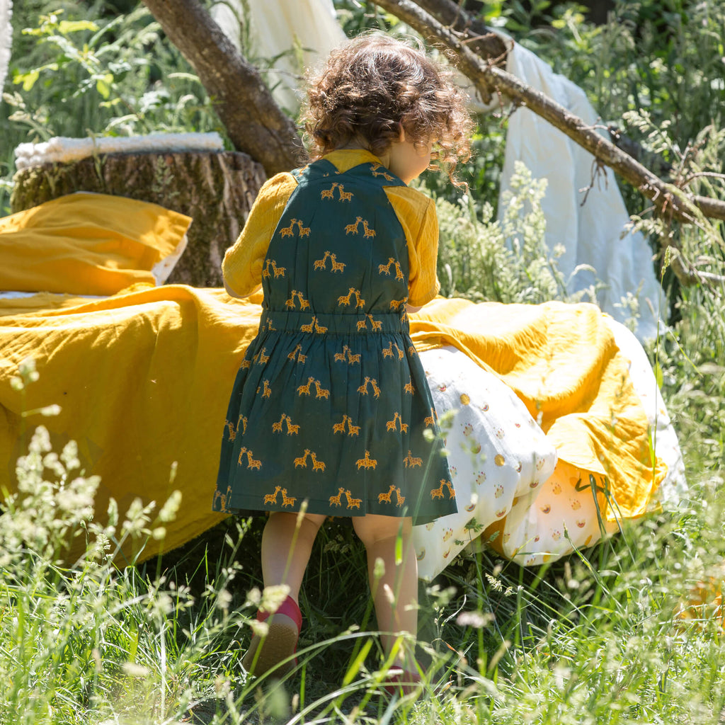 Little-Green-Radicals-Green-And-Yellow-Pinafore-Dress-With-Giraffe-Print-Kid-Back