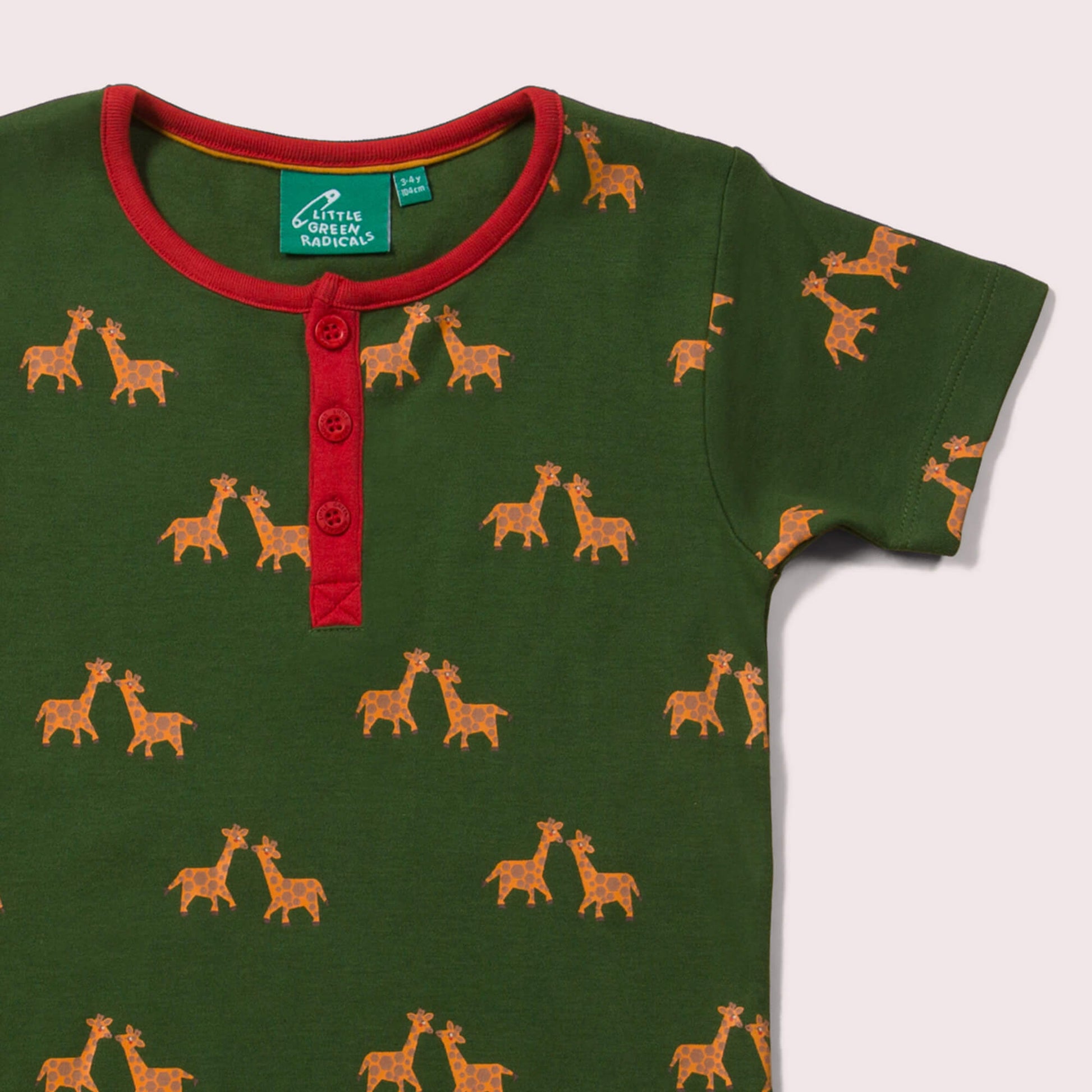 Little-Green-Radicals-Green-And-Yellow-Short-Sleeve-Henley-Top-With-Giraffe-Print-Closeup