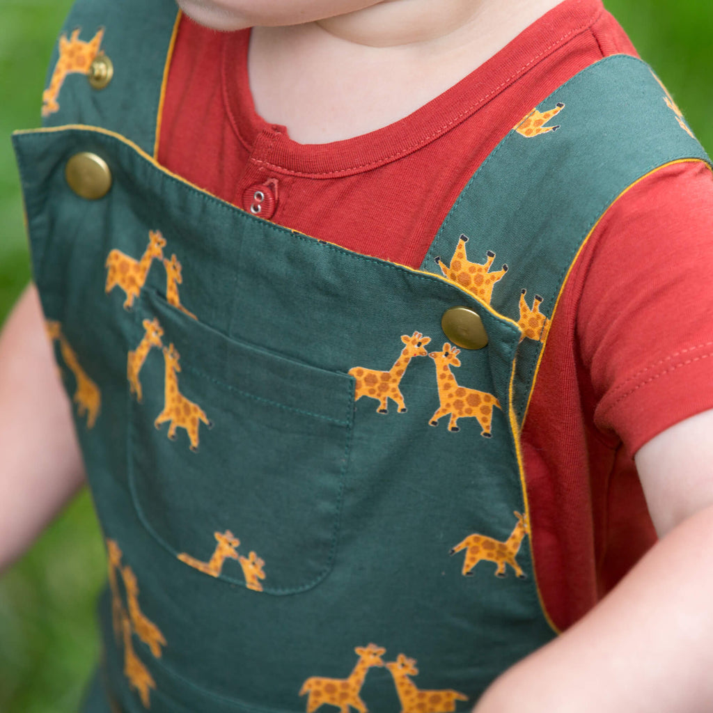 Little-Green-Radicals-Green-and_Yellow-Shortie-Dungarees-With-Giraffe-Print-Kid-Closeup
