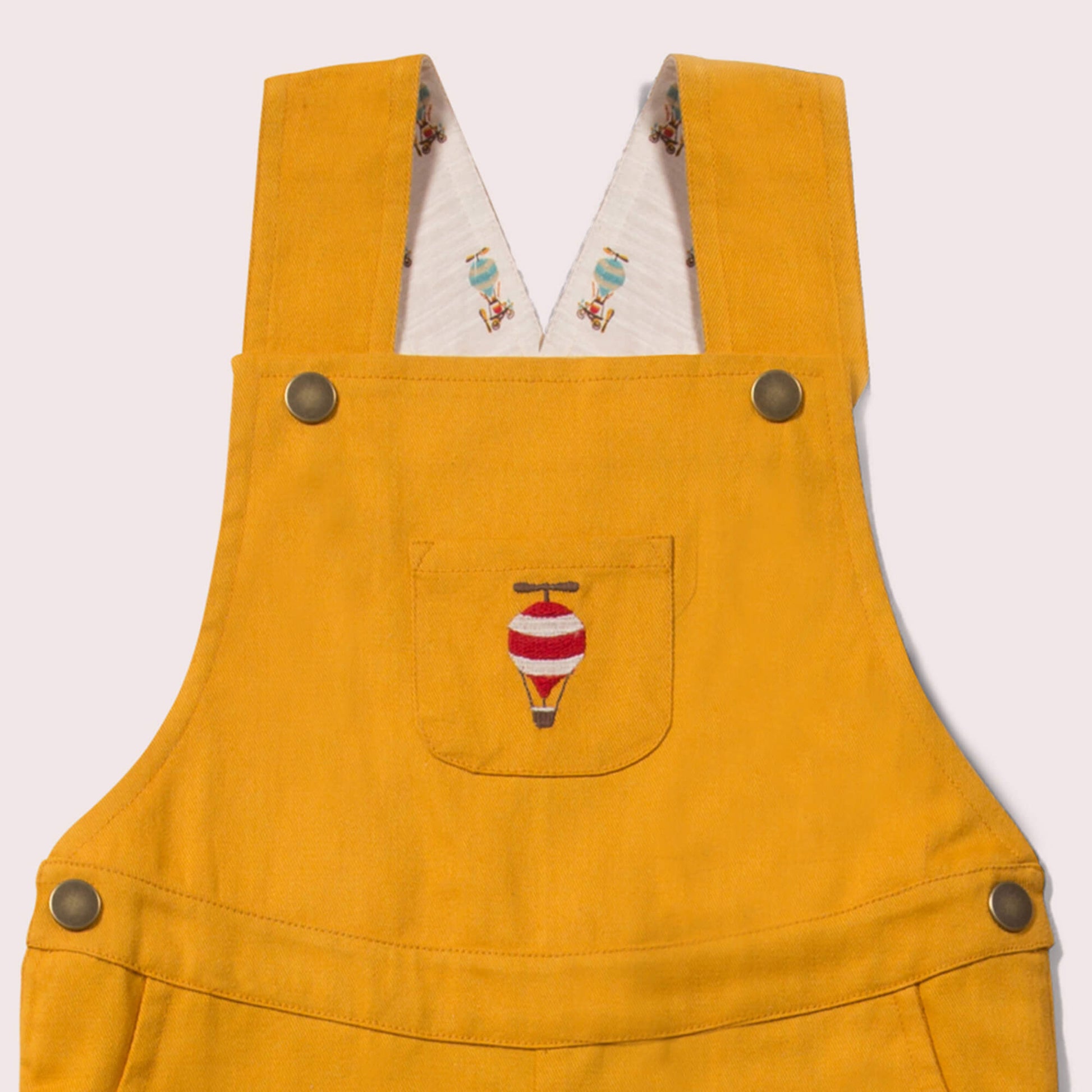 Little-Green-Radicals-Orange-Shortie-Dungarees-With-Balloon-Print-Closeup