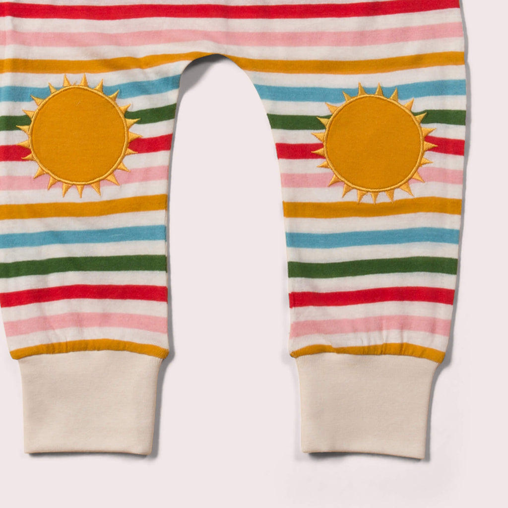 Little-Green-Radicals-Rainbow-Striped-Patch-Joggers-With-Sunshine-Print-Closeup