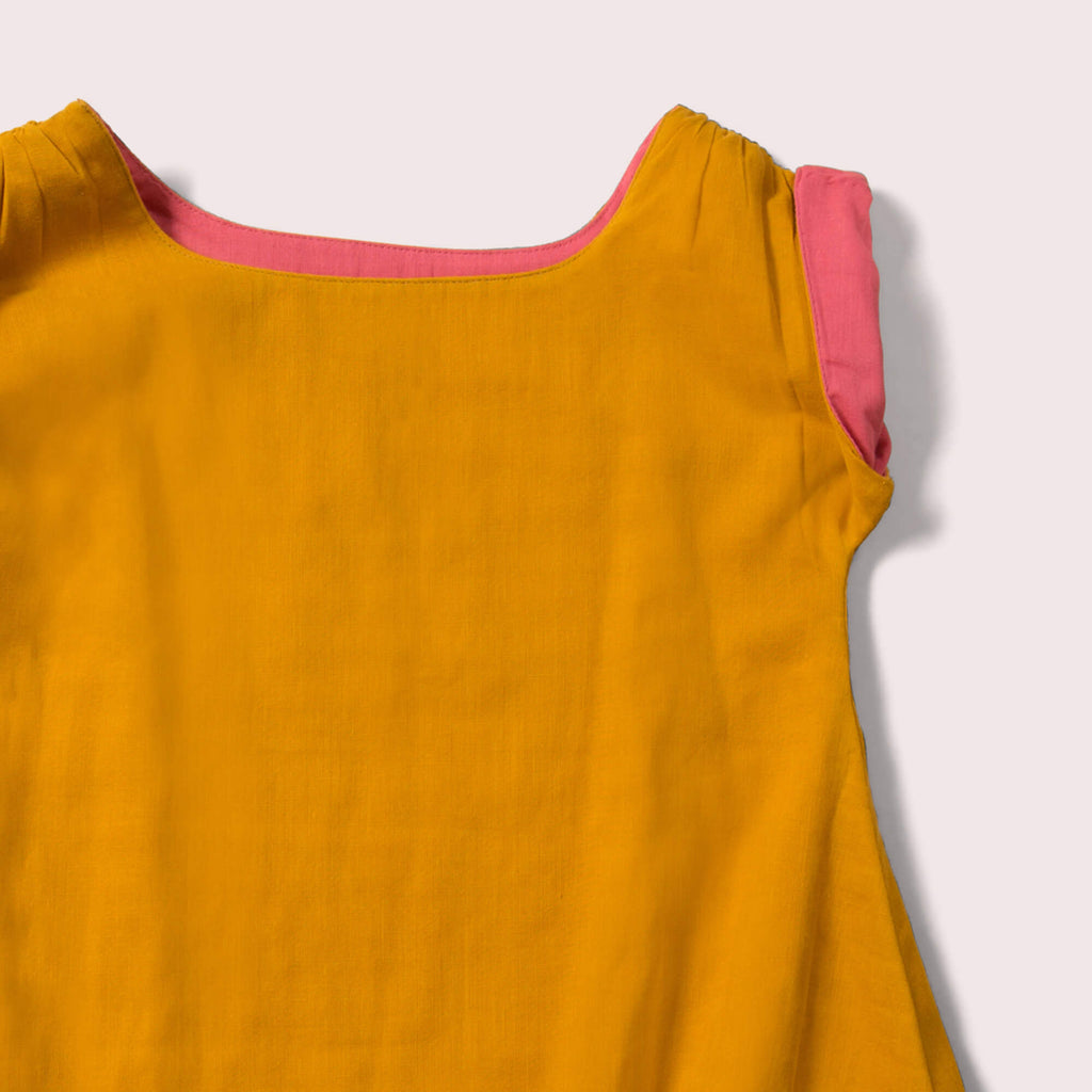 Little-Green-Radicals-Yellow-And-Pink-Reversible-Dress-Closeup