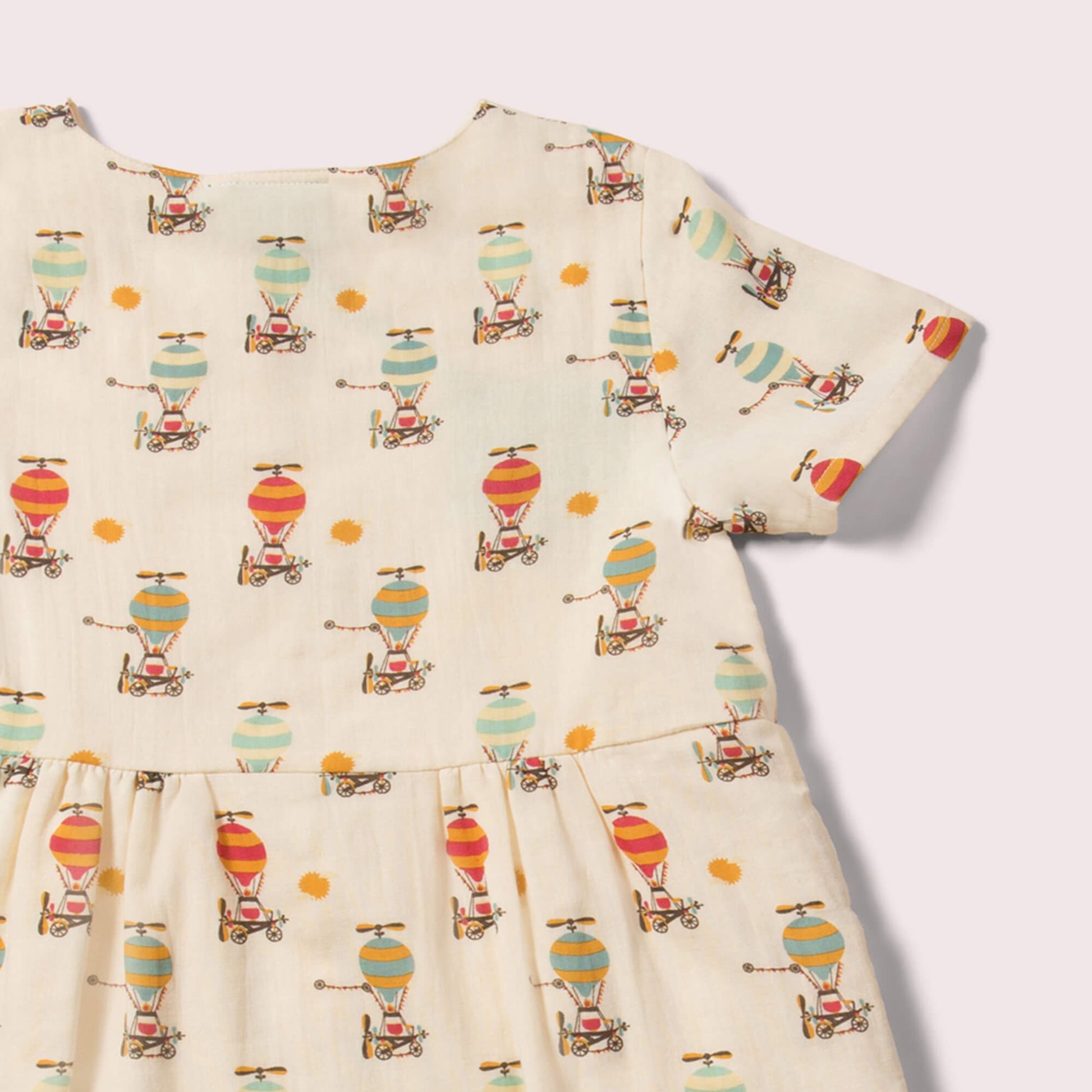 Little-Green-Radicals_Cream-Organic-Button-Dress-With-Hot-Air-Balloon-Print-Closeup