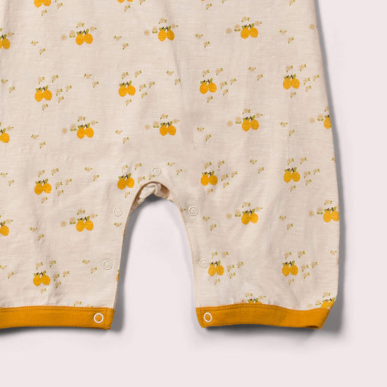 Little-Green-Radicals_Cream-and-Yellow-Organic-Shortie-Romper-With-Lemon-Grove-Print-Kid-Posing