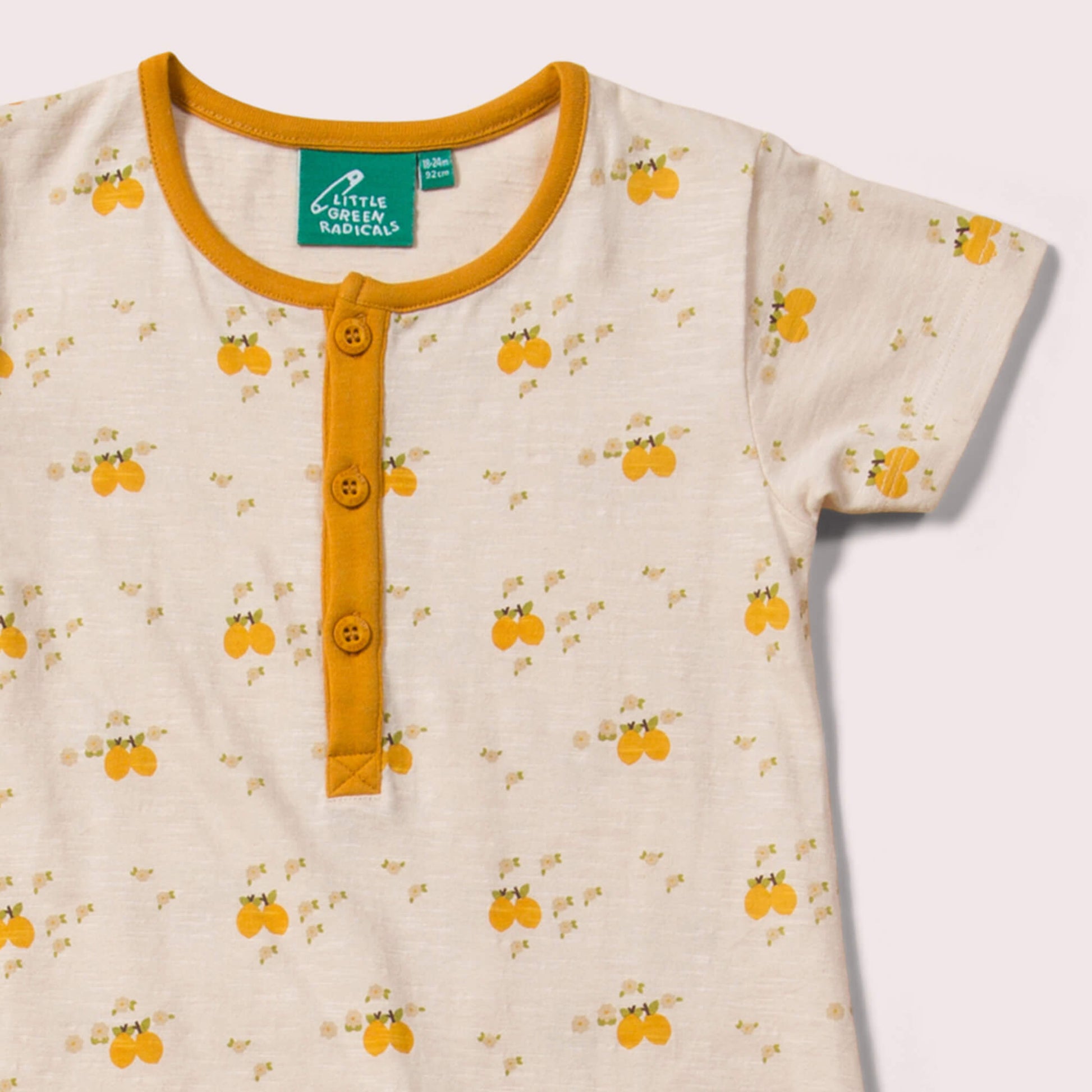 Little-Green-Radicals_Cream-and-Yellow-Organic-Shortie-Romper-With-Lemon-Grove-Print-Closeup