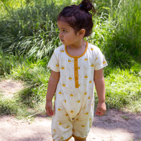 Little-Green-Radicals_Cream-and-Yellow-Organic-Shortie-Romper-With-Lemon-Grove-Print-Kid-Model