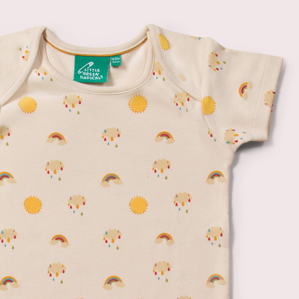 Little-Green-Radicals_Cream-and_Yellow-Striped-Baby-Bodies-Set-Two-Pack-With-Sunshine-and-Rainbow-Print-Closeup