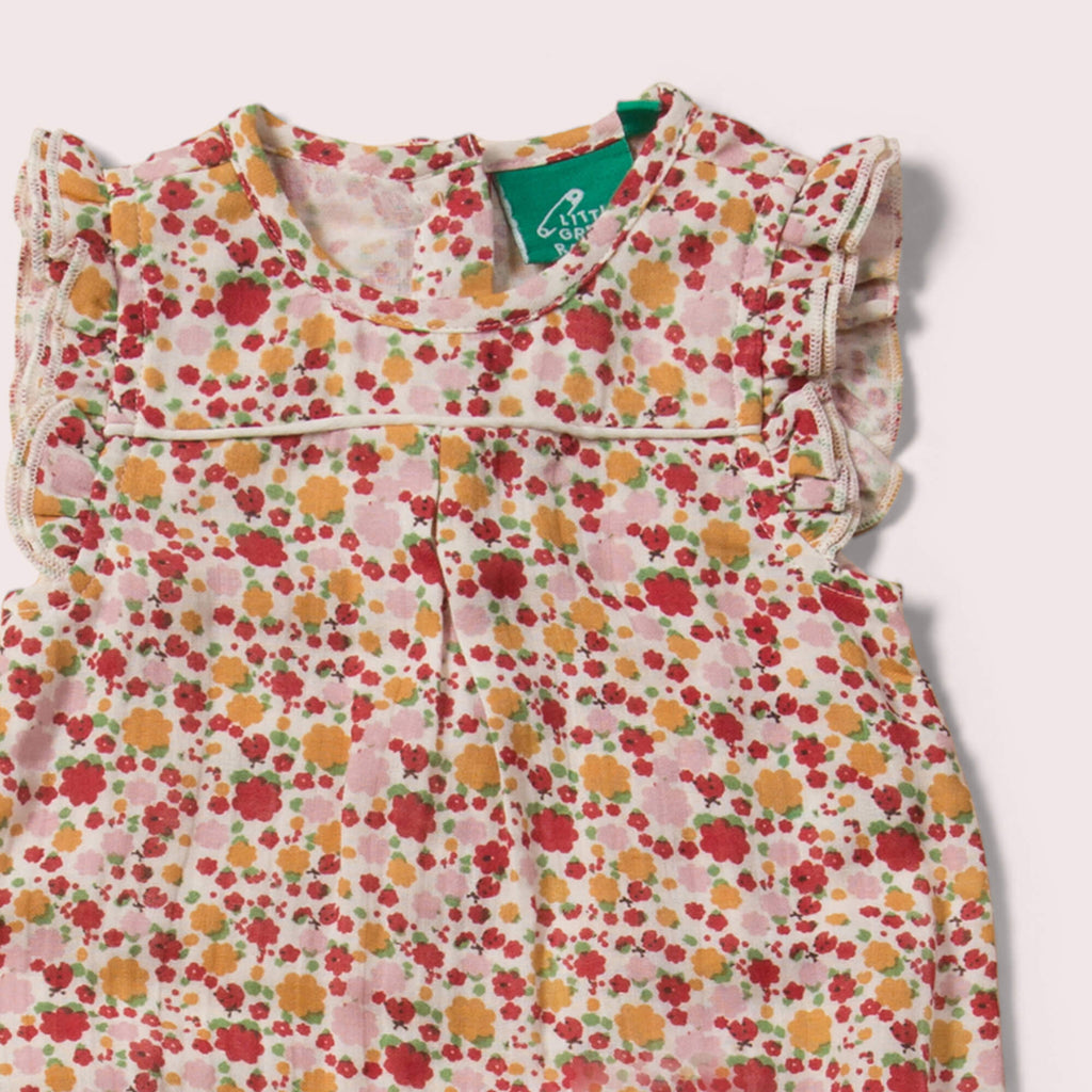 Little-Green-Radicals_Red-Yellow-Pink-And_Cream-Organic-Summer-Romper-With-Ladybird-Pattern-Closeup