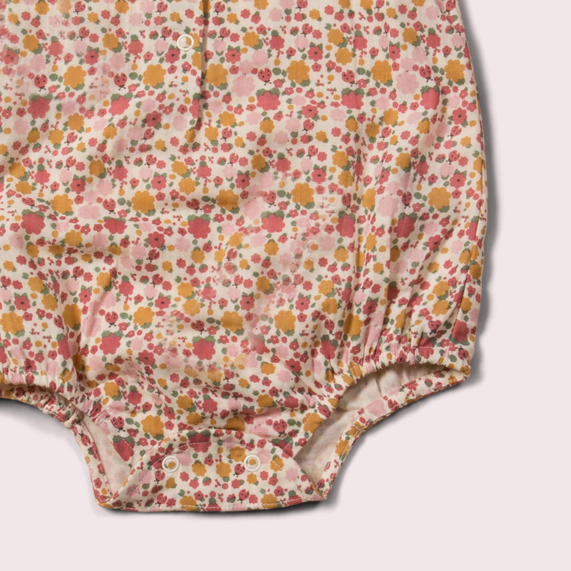 Little-Green-Radicals_Red-and-Pink-Organic-Sleeveless-Baby-Bubble-Body-With-Ladybird-Print-Closeup-View